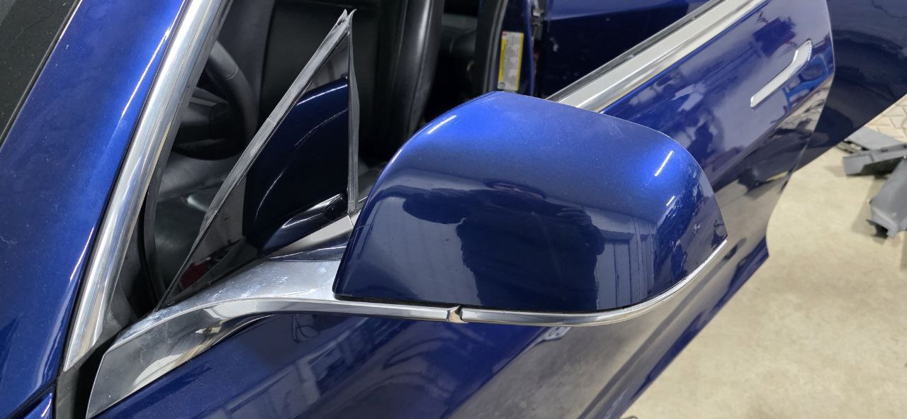 Completed mirror installation on blue Model 3